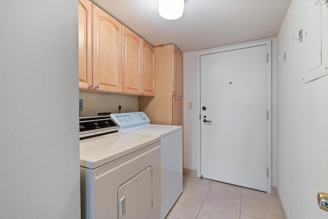 4740 S Ocean Blvd Unit 1403, Highland Beach, FL 33487 - washroom with cabinet space, washing machine and dryer, light tile patterned floors, and baseboards