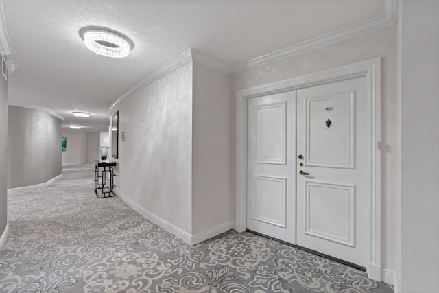 4740 S Ocean Blvd Unit 1403, Highland Beach, FL 33487 - entrance foyer featuring baseboards, crown molding, and light colored carpet