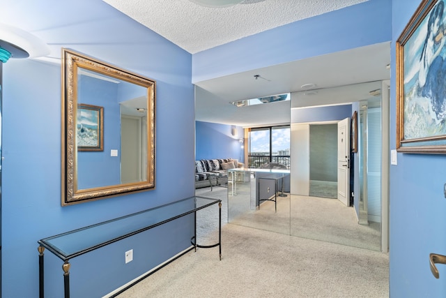 4740 S Ocean Blvd Unit 1403, Highland Beach, FL 33487 - corridor featuring carpet floors and a textured ceiling