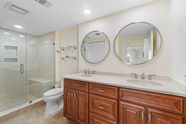 36 Stratford Ln Unit H, Boynton Beach, FL 33436 - full bath featuring double vanity, a stall shower, tile patterned floors, and recessed lighting
