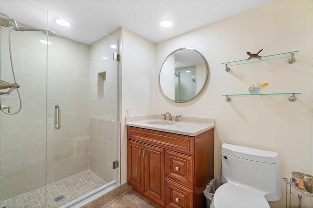 36 Stratford Ln Unit H, Boynton Beach, FL 33436 - bathroom featuring vanity, a shower stall, tile patterned floors, and recessed lighting