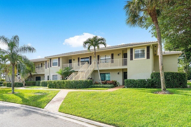 36 Stratford Ln Unit H, Boynton Beach, FL 33436 - view of property featuring stairway