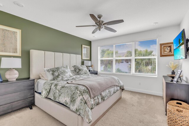 4340 Lago Dr, Deerfield Beach, FL 33064 - bedroom featuring light colored carpet, baseboards, and a ceiling fan