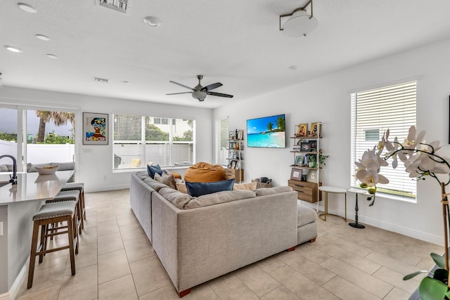 4340 Lago Dr, Deerfield Beach, FL 33064 - living room with plenty of natural light, ceiling fan, and baseboards