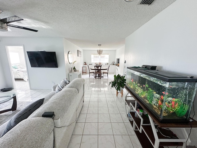 106 Lake Helen Dr, West Palm Beach, FL 33411 - living area with light marble finish flooring, a chandelier, a textured ceiling, and ceiling fan