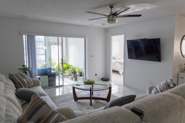 106 Lake Helen Dr, West Palm Beach, FL 33411 - living room featuring light tile patterned flooring, ceiling fan, and a textured ceiling