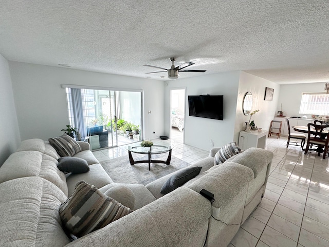 106 Lake Helen Dr, West Palm Beach, FL 33411 - living room with light tile patterned flooring, ceiling fan, and a textured ceiling