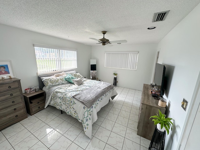 106 Lake Helen Dr, West Palm Beach, FL 33411 - bedroom featuring light marble finish flooring, ceiling fan, and a textured ceiling