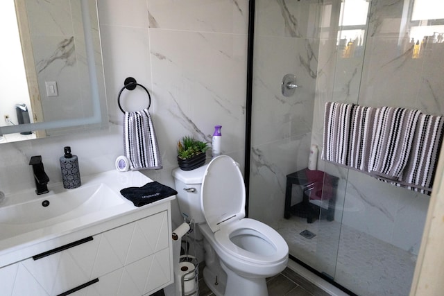 106 Lake Helen Dr, West Palm Beach, FL 33411 - full bathroom featuring tile walls, vanity, a marble finish shower, and toilet