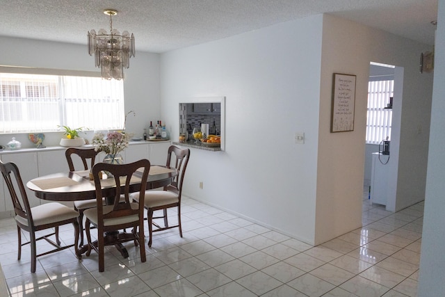 106 Lake Helen Dr, West Palm Beach, FL 33411 - dining room with a chandelier, light tile patterned floors, and a textured ceiling