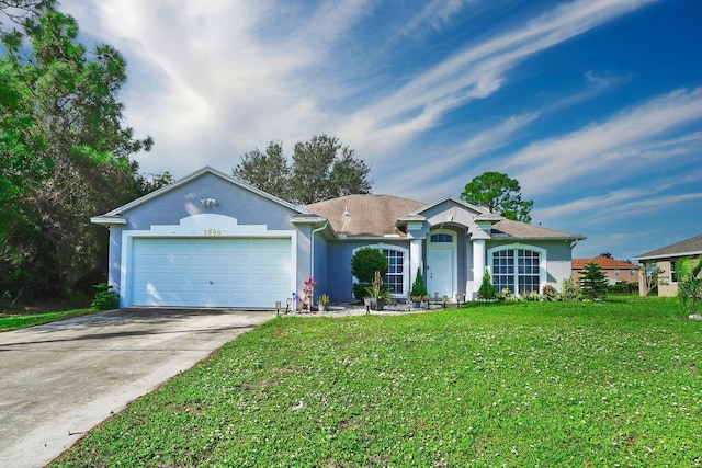 3990 Halcomb St, Port Saint Lucie, FL 34953 - ranch-style home featuring stucco siding, an attached garage, a front lawn, and concrete driveway