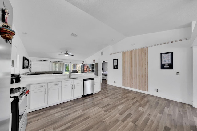 3990 Halcomb St, Port Saint Lucie, FL 34953 - kitchen featuring range, a sink, open floor plan, dishwasher, and vaulted ceiling