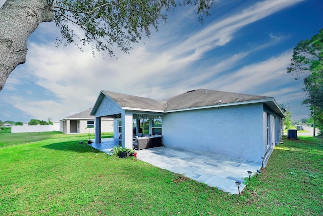 3990 Halcomb St, Port Saint Lucie, FL 34953 - rear view of property with a patio, central AC unit, a yard, and stucco siding