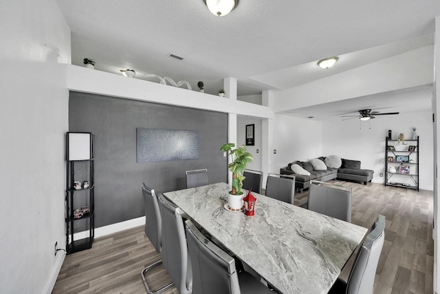 3990 Halcomb St, Port Saint Lucie, FL 34953 - dining area with wood finished floors, ceiling fan, and baseboards