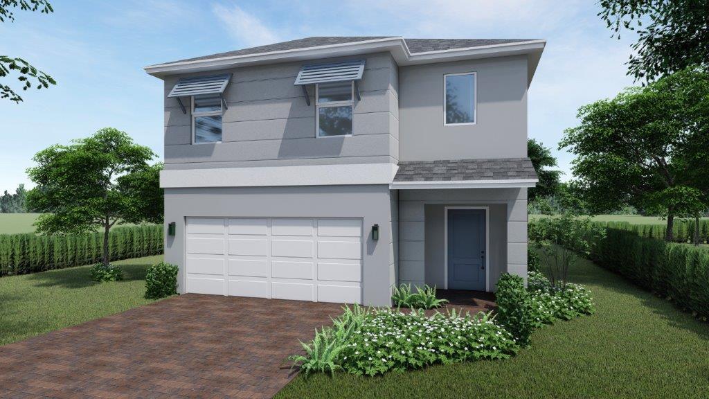 748 NW 18th Way, Pompano Beach, FL 33069 - contemporary home with a garage, decorative driveway, stucco siding, and a front yard