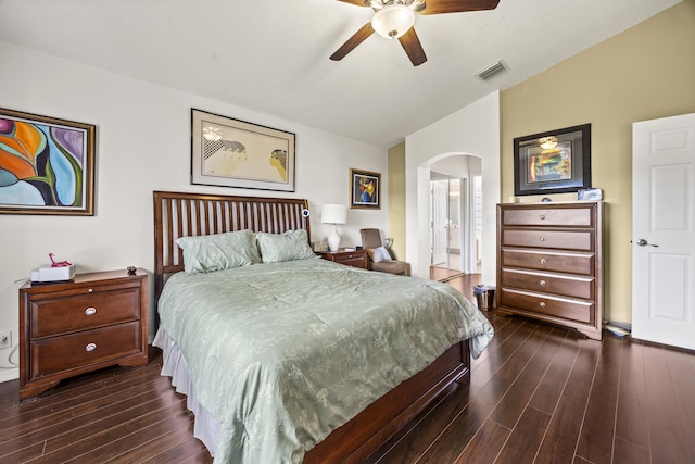 7116 Trentino Way, Boynton Beach, FL 33472 - bedroom with vaulted ceiling, arched walkways, dark wood-style flooring, a ceiling fan, and ensuite bath