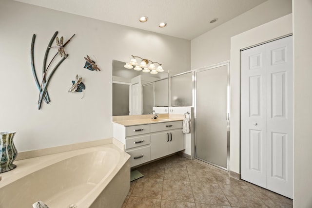 7116 Trentino Way, Boynton Beach, FL 33472 - bathroom with a closet, a bath, vanity, a shower stall, and recessed lighting