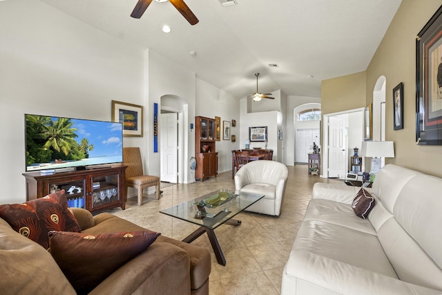 7116 Trentino Way, Boynton Beach, FL 33472 - living room with ceiling fan, arched walkways, light tile patterned floors, and high vaulted ceiling