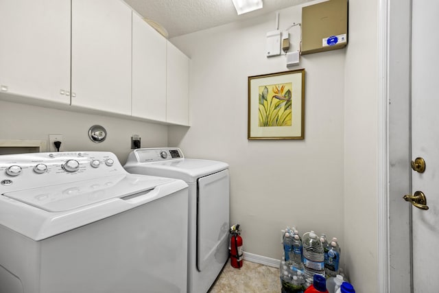 7116 Trentino Way, Boynton Beach, FL 33472 - laundry area with washer and dryer, cabinet space, baseboards, and a textured ceiling