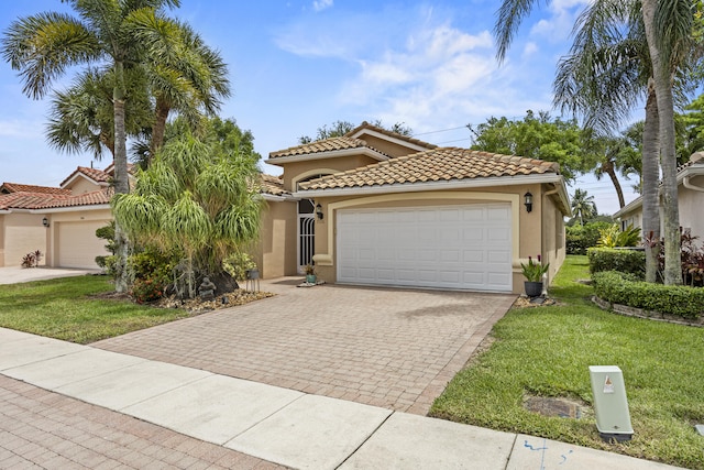 7116 Trentino Way, Boynton Beach, FL 33472 - mediterranean / spanish home with stucco siding, a front yard, an attached garage, and driveway