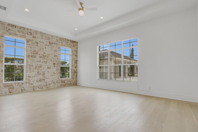 10032 Calabrese Trl, Jupiter, FL 33478 - unfurnished room featuring wood finished floors, recessed lighting, a ceiling fan, baseboards, and a tray ceiling