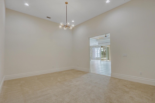 10032 Calabrese Trl, Jupiter, FL 33478 - spare room featuring carpet floors, a chandelier, recessed lighting, and ceiling fan