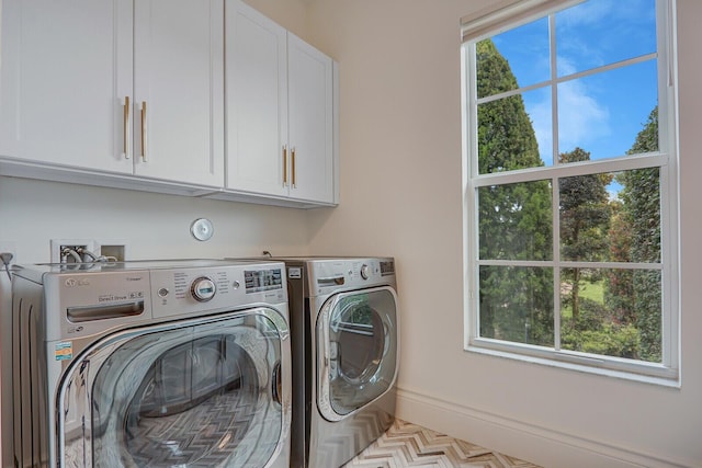 10032 Calabrese Trl, Jupiter, FL 33478 - laundry room with cabinet space and washing machine and dryer