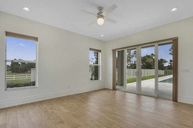 10032 Calabrese Trl, Jupiter, FL 33478 - empty room featuring ceiling fan, light wood finished floors, baseboards, and recessed lighting