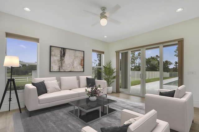 10032 Calabrese Trl, Jupiter, FL 33478 - living room with a ceiling fan, wood finished floors, healthy amount of natural light, recessed lighting, and baseboards