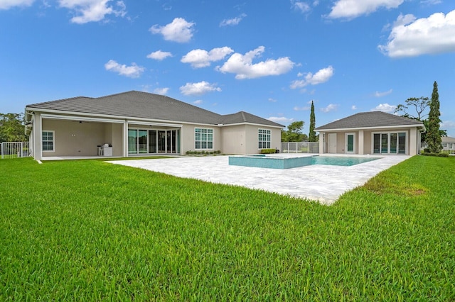10032 Calabrese Trl, Jupiter, FL 33478 - back of house with a patio, a pool with connected hot tub, and stucco siding