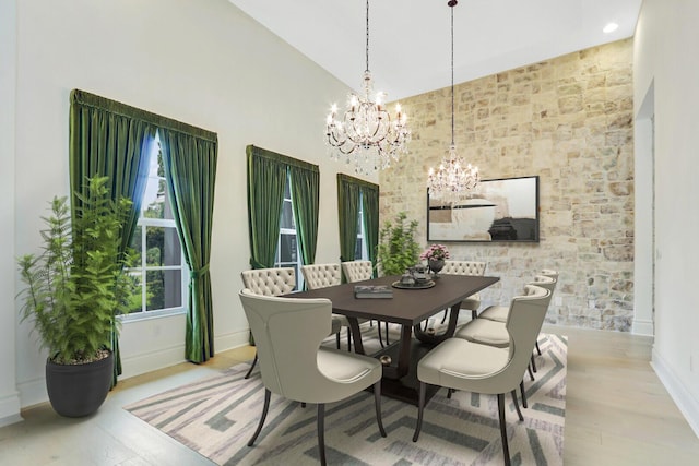 10032 Calabrese Trl, Jupiter, FL 33478 - dining area with a chandelier, wood finished floors, and lofted ceiling