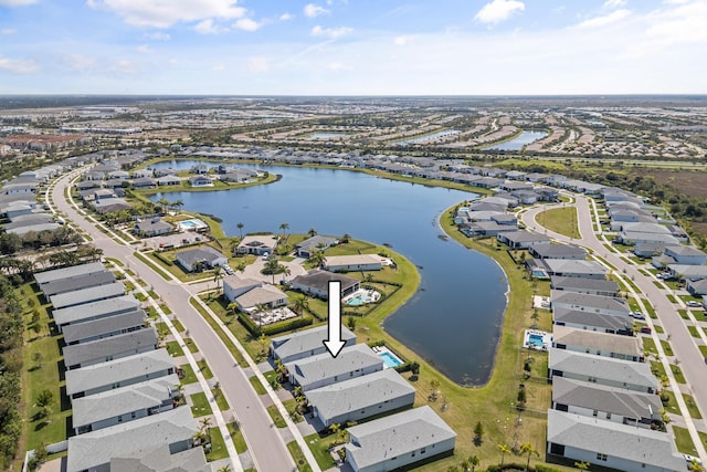 11244 SW Lyra Dr, Port Saint Lucie, FL 34987 - aerial view of property and surrounding area featuring a large body of water and nearby suburban area