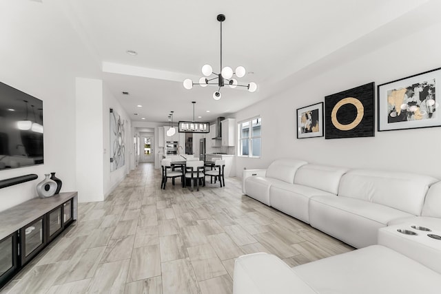 11244 SW Lyra Dr, Port Saint Lucie, FL 34987 - living room featuring a chandelier and recessed lighting