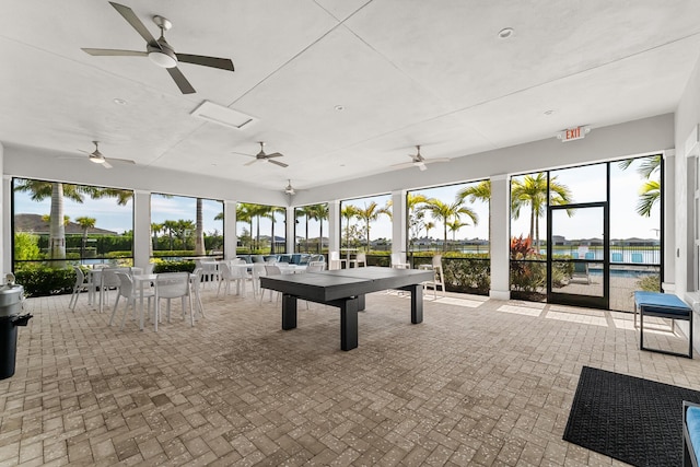 11244 SW Lyra Dr, Port Saint Lucie, FL 34987 - rec room featuring healthy amount of natural light, a ceiling fan, and brick patterned flooring