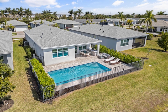 11244 SW Lyra Dr, Port Saint Lucie, FL 34987 - view of swimming pool with outdoor lounge area, a residential view, an outdoor kitchen, and a patio area