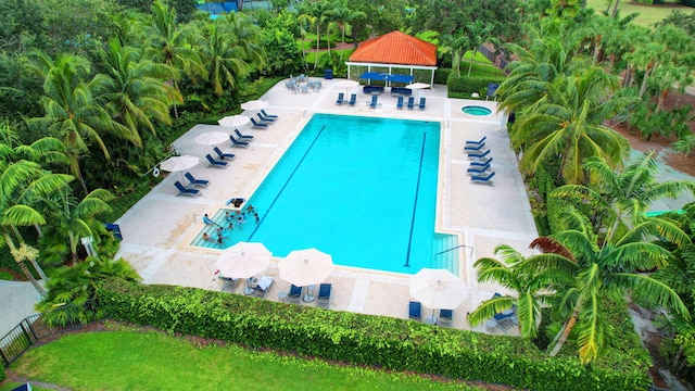 9278 Heathridge Dr, West Palm Beach, FL 33411 - community pool featuring a gazebo, view of wooded area, a patio, and a hot tub