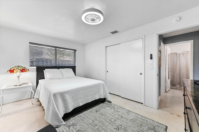 4311 NE 16th Ave, Oakland Park, FL 33334 - bedroom featuring dark aggregate flooring and a closet