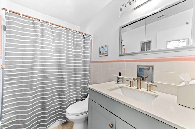 4311 NE 16th Ave, Oakland Park, FL 33334 - full bathroom with vanity, tile walls, and wainscoting