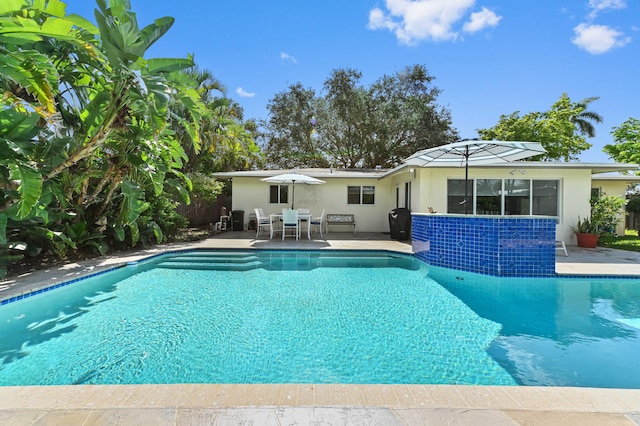 4311 NE 16th Ave, Oakland Park, FL 33334 - swimming pool featuring a patio area and outdoor dining area