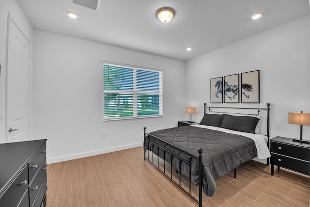 14517 Three Ponds Trl, Delray Beach, FL 33446 - bedroom with light wood finished floors, baseboards, and recessed lighting