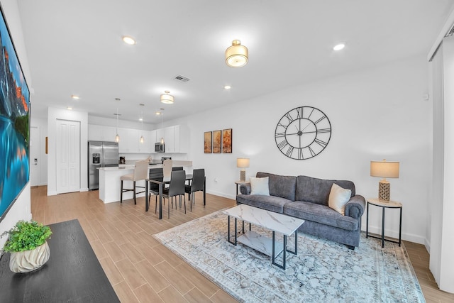 14517 Three Ponds Trl, Delray Beach, FL 33446 - living room featuring baseboards, light wood-type flooring, and recessed lighting