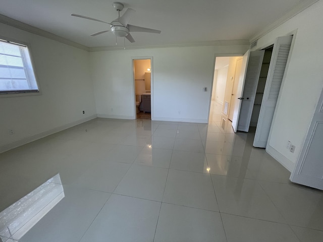 1225 NW 21st St NW Unit 15-1505, Stuart, FL 34994 - unfurnished bedroom featuring ornamental molding, baseboards, light tile patterned floors, ensuite bathroom, and ceiling fan