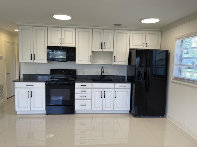 1225 NW 21st St NW Unit 15-1505, Stuart, FL 34994 - kitchen featuring black appliances, a sink, crown molding, baseboards, and white cabinets