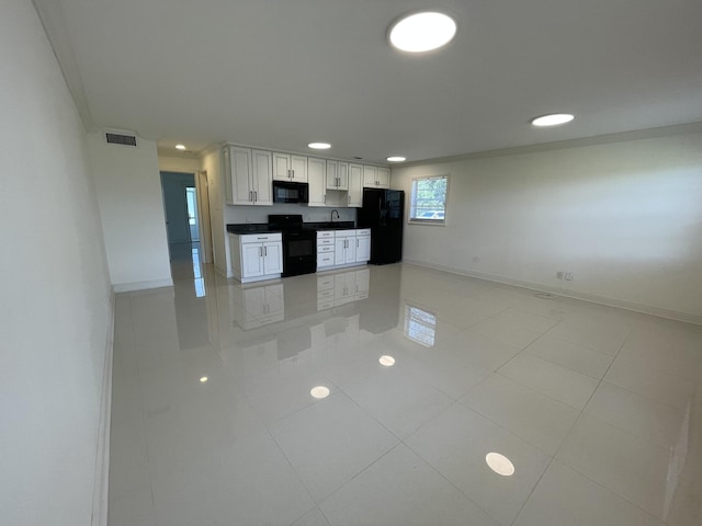 1225 NW 21st St NW Unit 15-1505, Stuart, FL 34994 - kitchen with black appliances, baseboards, recessed lighting, light tile patterned floors, and a sink