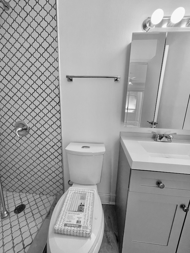 1225 NW 21st St NW Unit 15-1505, Stuart, FL 34994 - full bathroom featuring vanity, toilet, and a tile shower