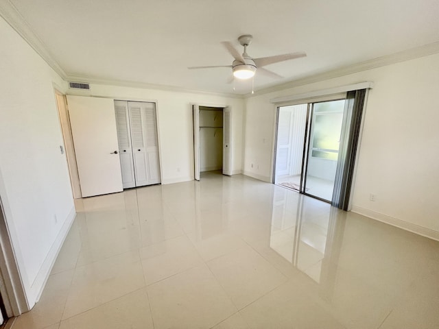 1225 NW 21st St NW Unit 15-1505, Stuart, FL 34994 - unfurnished bedroom with crown molding, access to exterior, baseboards, and two closets