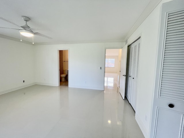 1225 NW 21st St NW Unit 15-1505, Stuart, FL 34994 - empty room with baseboards, ornamental molding, and a ceiling fan
