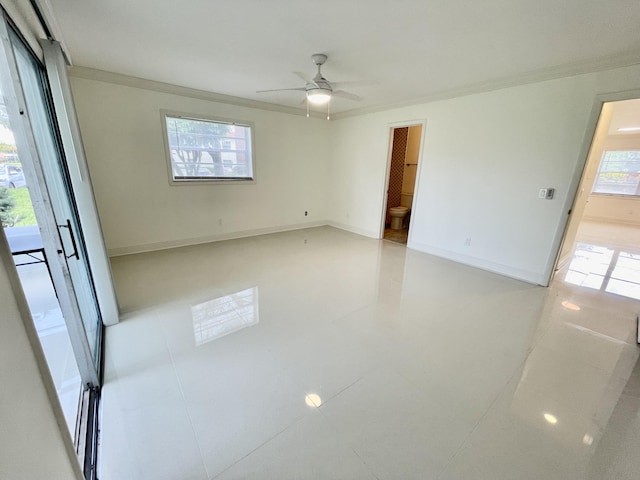 1225 NW 21st St NW Unit 15-1505, Stuart, FL 34994 - spare room with ornamental molding, a ceiling fan, and baseboards