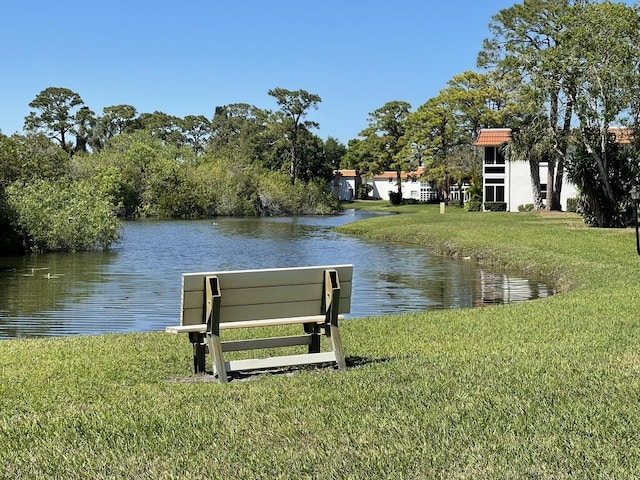 1225 NW 21st St NW Unit 15-1505, Stuart, FL 34994 - dock with a water view and a lawn