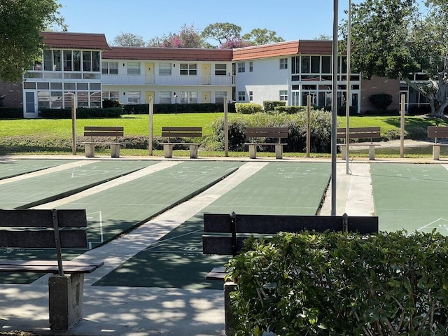 1225 NW 21st St NW Unit 15-1505, Stuart, FL 34994 - surrounding community featuring a yard and shuffleboard